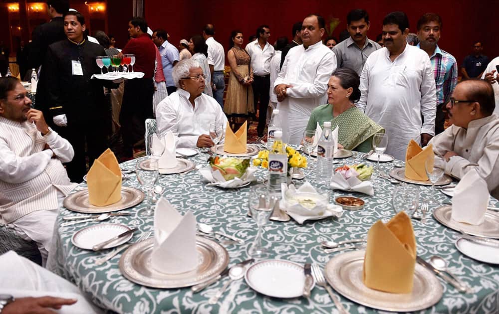 Congress President Sonia Gandhi with RJD chief Lalu Yadav, JD(U) chief Sharad Yadav and NCP leader Tariq Anwar (R) during her Iftar party in New Delhi.