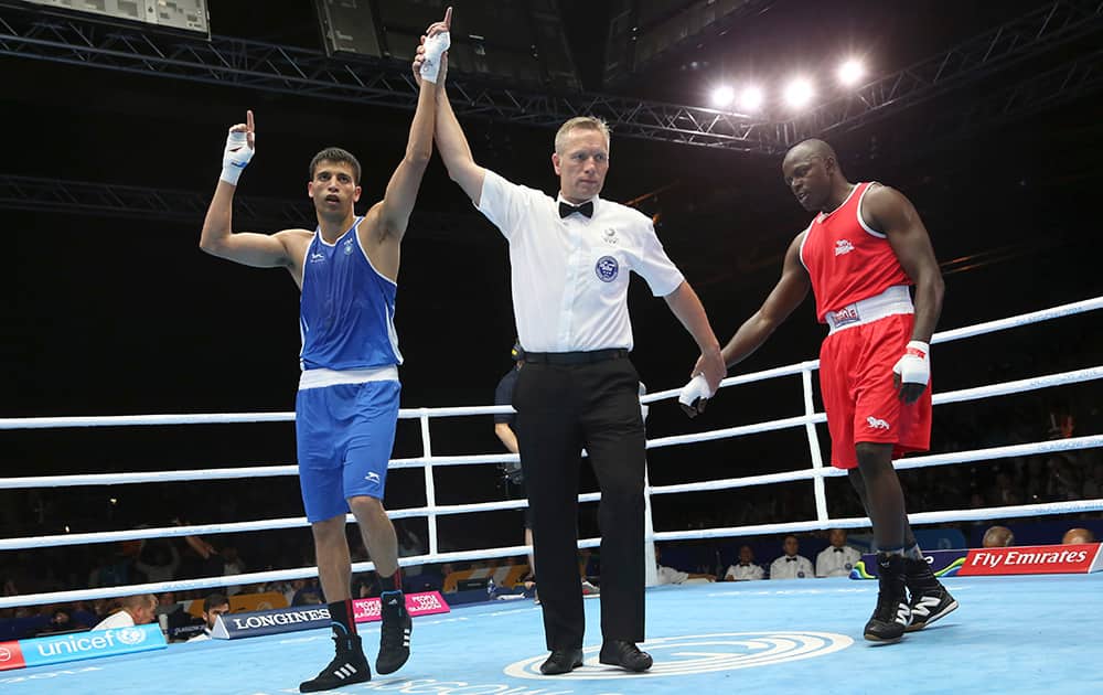 India`s Sumit Sangwan, left, celebrates after defeating Tanzania`s Mohamed Hakimu Fumu in their men`s light heavywight boxing preliminary match at the Commonwealth Games Glasgow 2014, in Scotland.