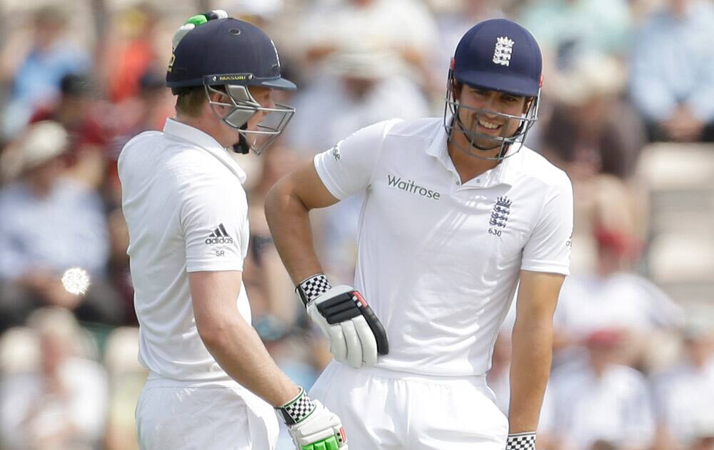 England`s opening batsmen captain Alastair Cook, right, and Sam Robson talk between overs during the first day of the third cricket test match of the series between England and India at The Ageas Bowl in Southampton, England.