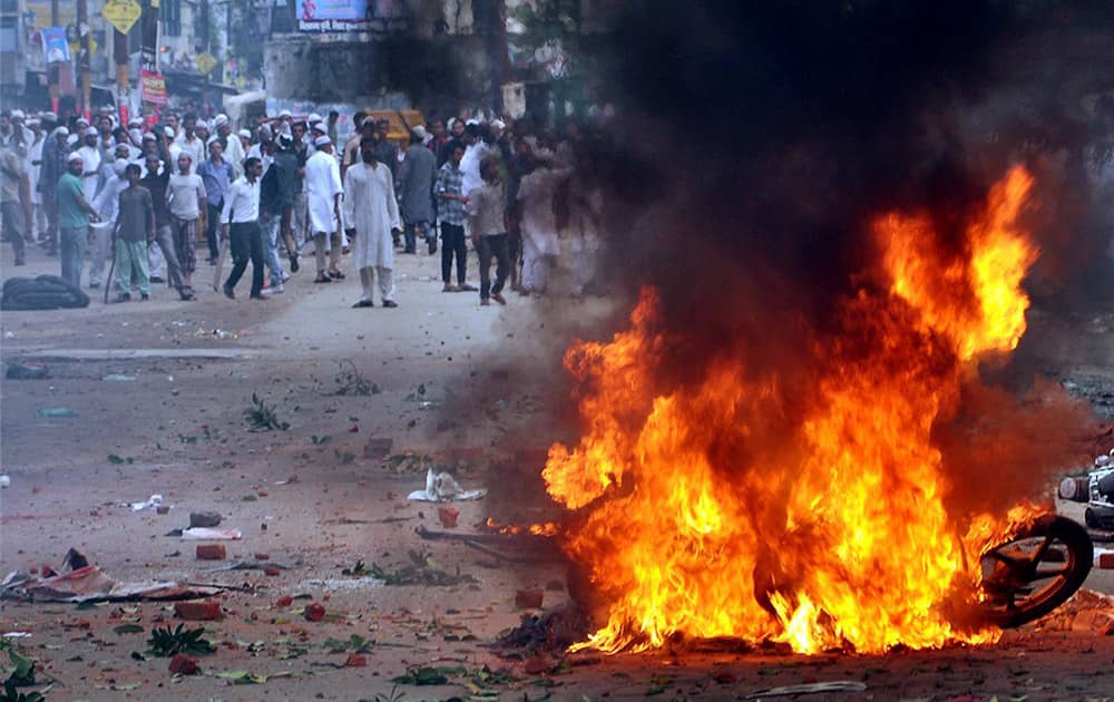 A bike burning during violent clashes between two communities over a land dispute in Saharanpur.