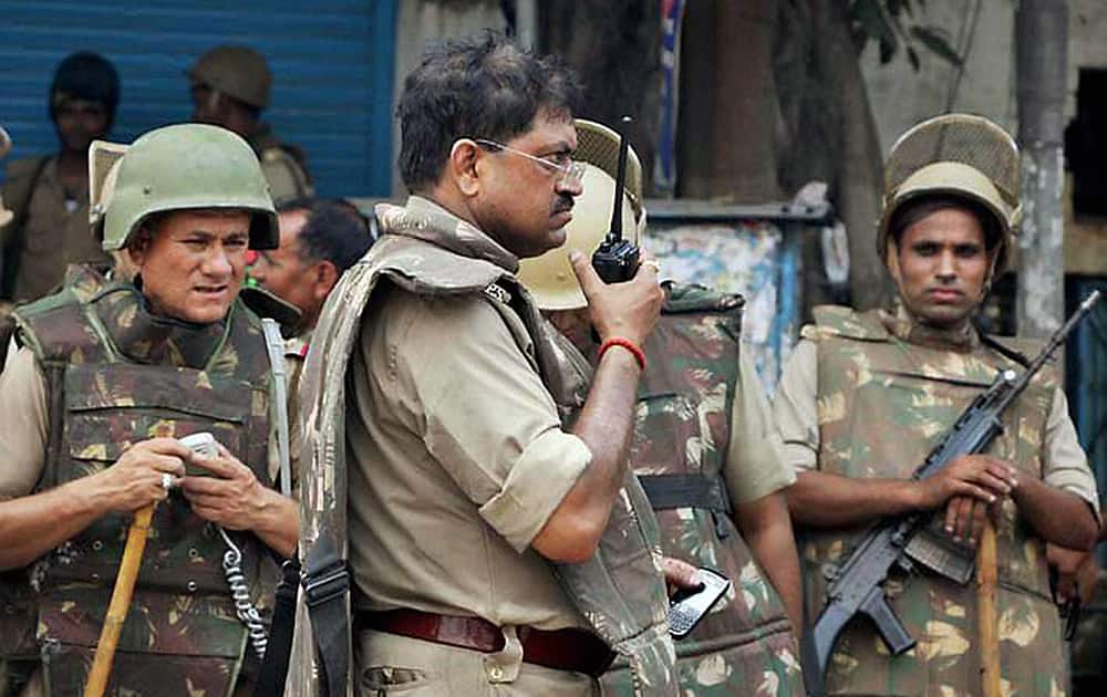 A senior police officer giving instructions during violent clashes between two communities over a land dispute in Saharanpur.