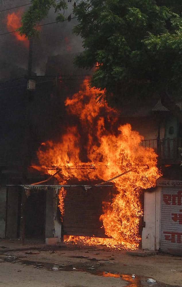 A shop in flames during violent clashes between two communities over a land dispute in Saharanpur.
