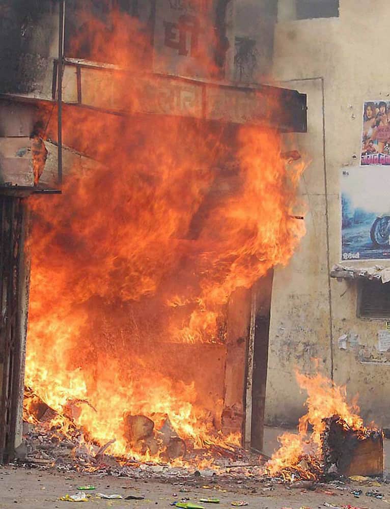 A shop in flames during violent clashes between two communities over a land dispute in Saharanpur.