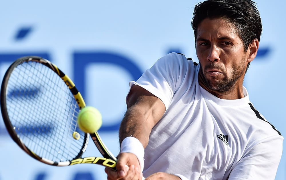 Fernando Verdasco of Spain returns a ball to Pablo Andujar of Spain during their semifinal match in the Swiss Open tennis tournament in Gstaad, Switzerland.