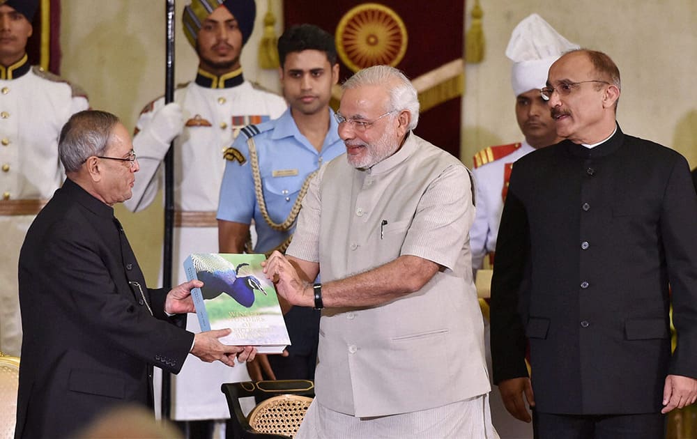 President Pranab Mukherjee and Prime Minister Narendra Modi during a book release function at Rashtrapati Bhavan in New Delhi.