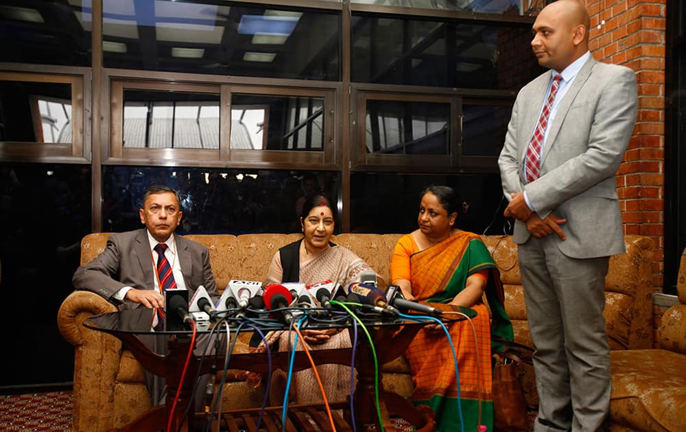 Indian Foreign Minister Sushma Swaraj speaks to the media upon arrival at the airport in Katmandu, Nepal.