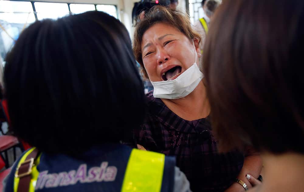 A relative of a victim in the TransAsia Airways flight GE222 crash cries during a funeral service on the Taiwan island of Penghu.