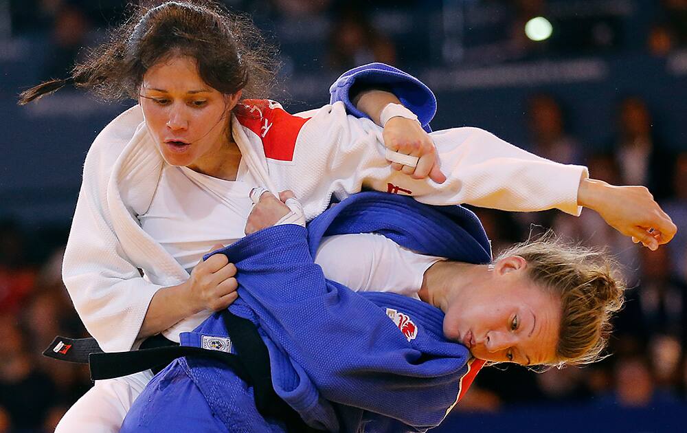 Scotland`s Louise Renicks, left, fights with Kelly Edwards from England during their women -52kg Judo final bout at the Commonwealth Games 2014 in Glasgow, Scotland.