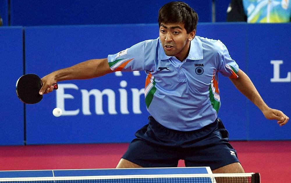 India`s Harmeet Rajul Desai in action against Vanuatu`s Ham Lulu during the Table Tennis men`s Team event at the Commonwealth Games in Glasgow, Scotland.