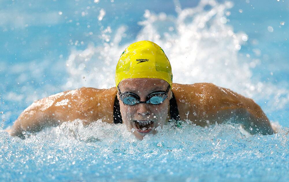 Ellen Gandy of Australia competes in a Women`s 100m Butterfly heat at the Tollcross International Swimming Centre during the Commonwealth Games 2014 in Glasgow, Scotland.