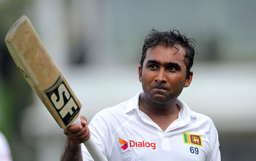 Sri Lankan cricketer Mahela Jayawardene celebrates his century during the first day of the second test cricket match between Sri Lanka and South Africa in Colombo, Sri Lanka.