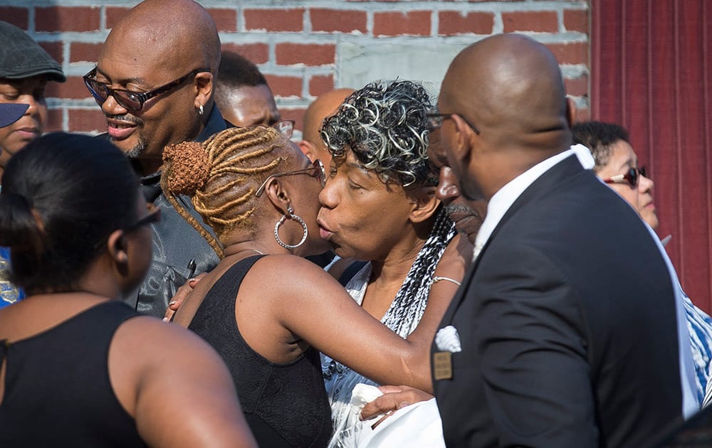 Gwen Carr, mother of Eric Garner, center, arrives at the funeral service of her son, the 43-year-old New York City man whose death while in police custody has led to accusations of police misconduct, at Bethel Baptist Church, in the Brooklyn borough of New York.