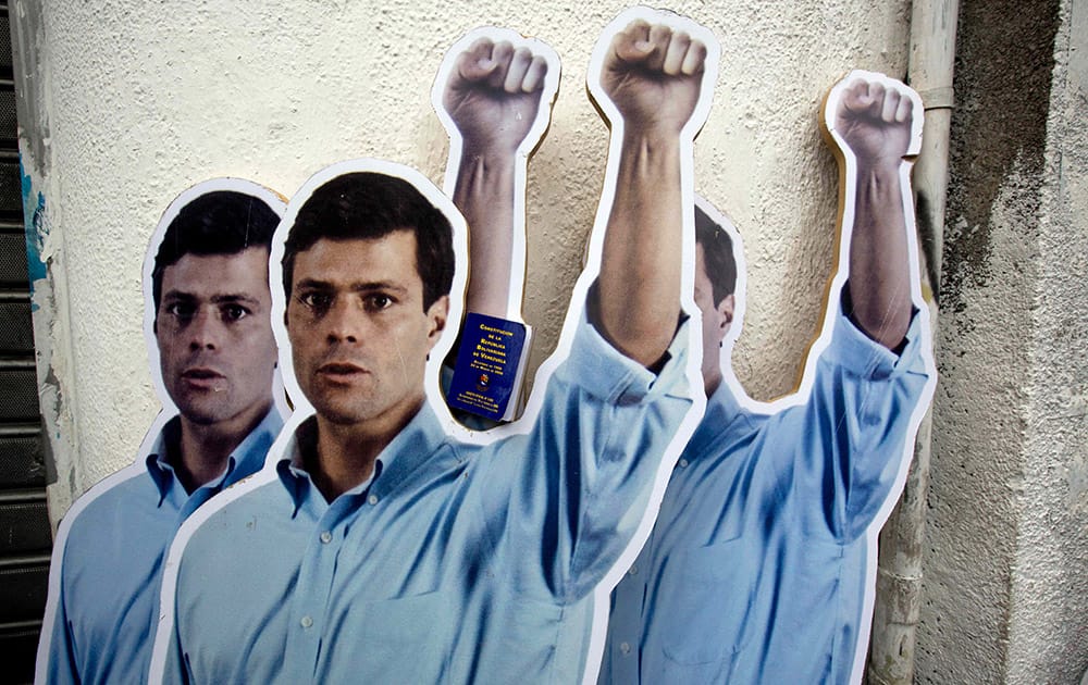 Supporters placed life-size cardboard cutouts of opposition leader Leopoldo Lopez outside the Justice Palace as the trial against Lopez for inciting violence at anti-government protests began, in Caracas, Venezuela.