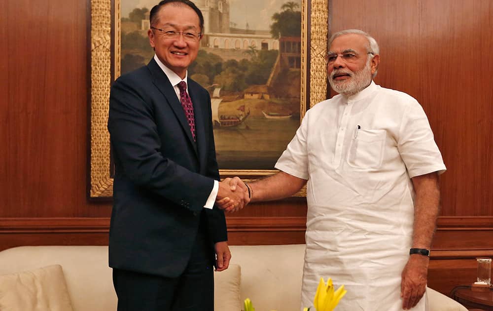 World Bank President Jim Yong Kim poses with Indian Prime Minister Narendra Modi before their meeting in New Delhi.