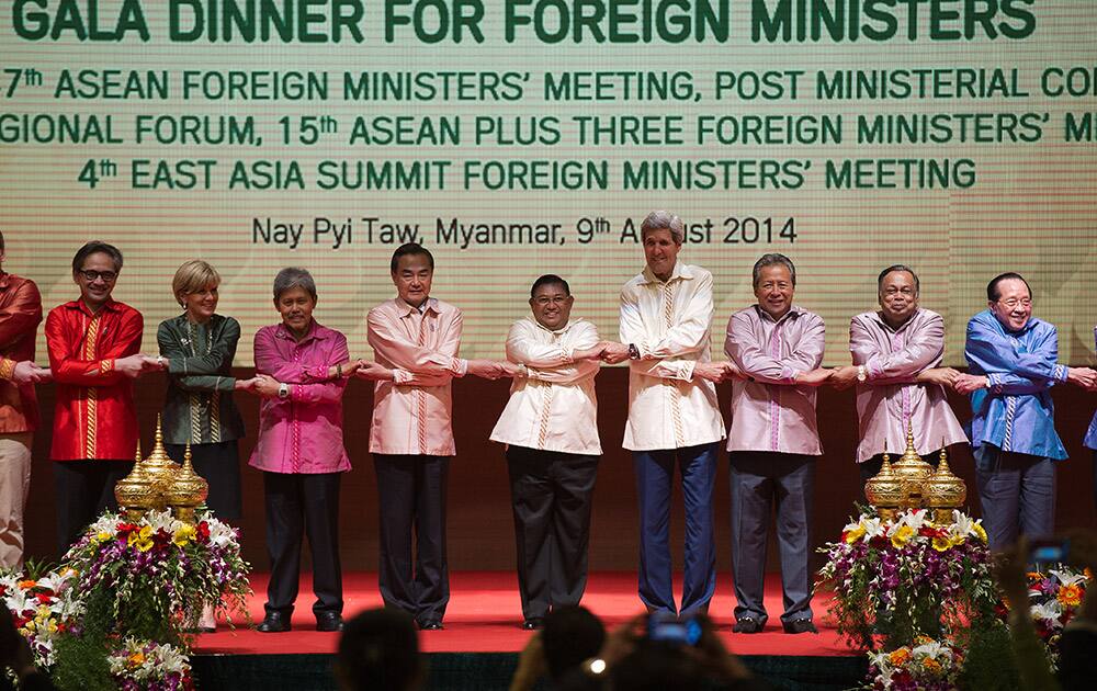 From left, Indonesia Foreign Minister Marty Natalegawa, Australia`s Foreign Minister Julia Bishop, Brunei`s Foreign Minister Mohammad Bolkiah, Chinese Foreign Minister Wang Yi, Myanmar Foreign Minister U Wunna Maung Lwin, US Secretary of State John Kerry, Malaysian Foreign Minister Anifah Aman, unidentified official and Cambodia Foreign Minister Hor Namhong join hands for a photo during the Association of Southeast Asian Nations (ASEAN) gala dinner hosted by Myanmar`s Union Minister for Foreign Affairs, H.E.U Wanna Maung Lwin, and Madam Daw Lynn Lynn Tin at the Myanmar International Convention Center (MICC) in Naypyidaw, Myanmar.