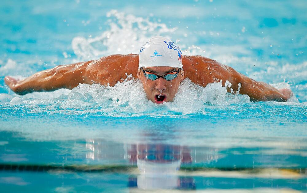 Michael Phelps swims in the men`s 100 meter butterfly final at the US nationals of swimming, in Irvine, Calif. Phelps took second in the event.