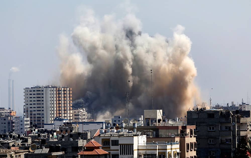 Smoke and dust rise over Gaza City after an Israeli strike, as Israel and Gaza militants resumed cross-border attacks after a three-day truce expired and Egyptian-brokered talks on a new border deal for blockaded Gaza hit a deadlock.