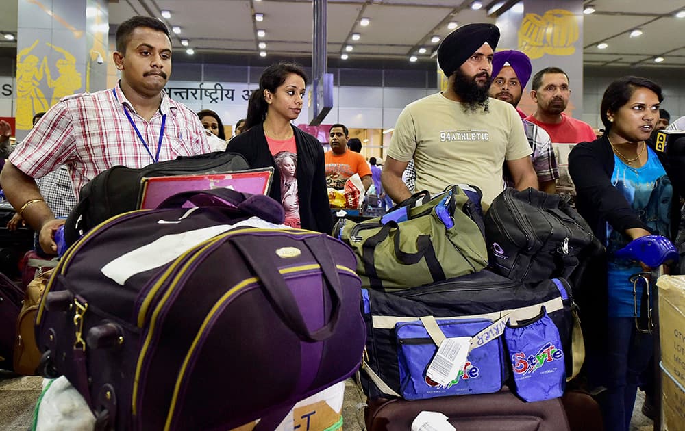 Indians evacuated from Libya, on their arrival at Delhi`s IGI airport on Thursday, early morning.