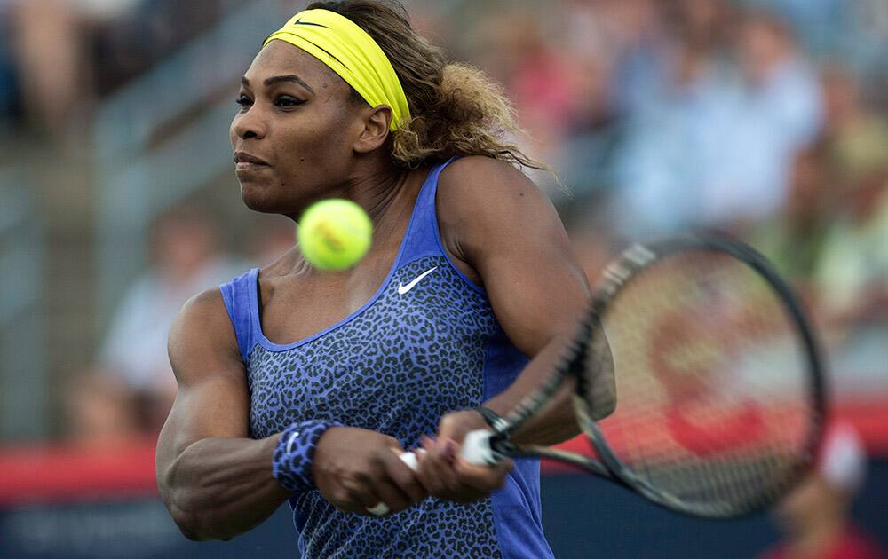 Serena Williams returns to Samantha Stosur, of Australia, at the Rogers Cup tennis tournament in Montreal.