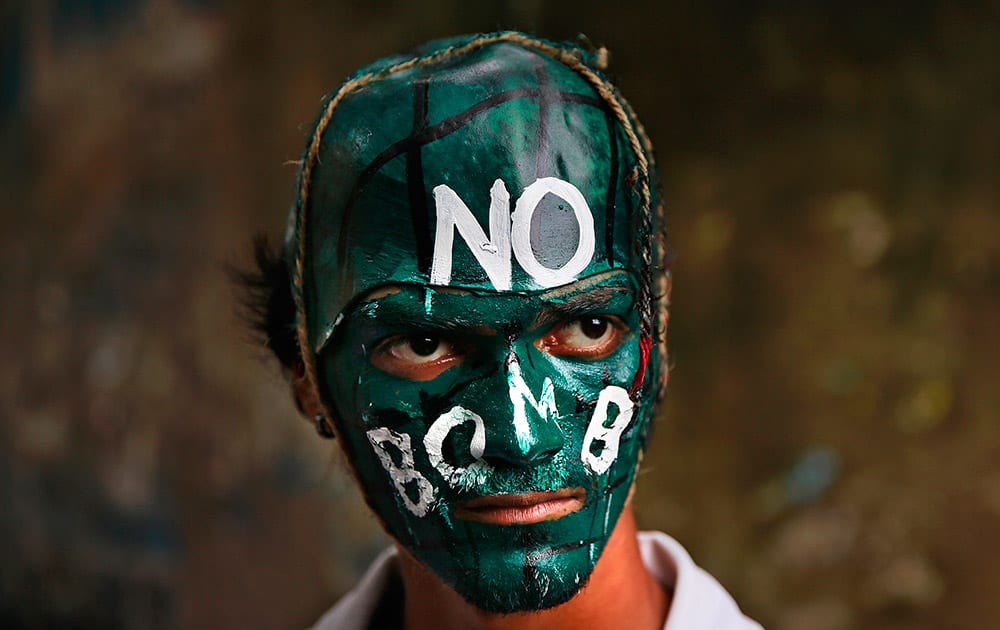 An indian student with painted face participates in a peace rally to mark the 69th anniversary of US atomic bombing of Hiroshima in Mumbai.