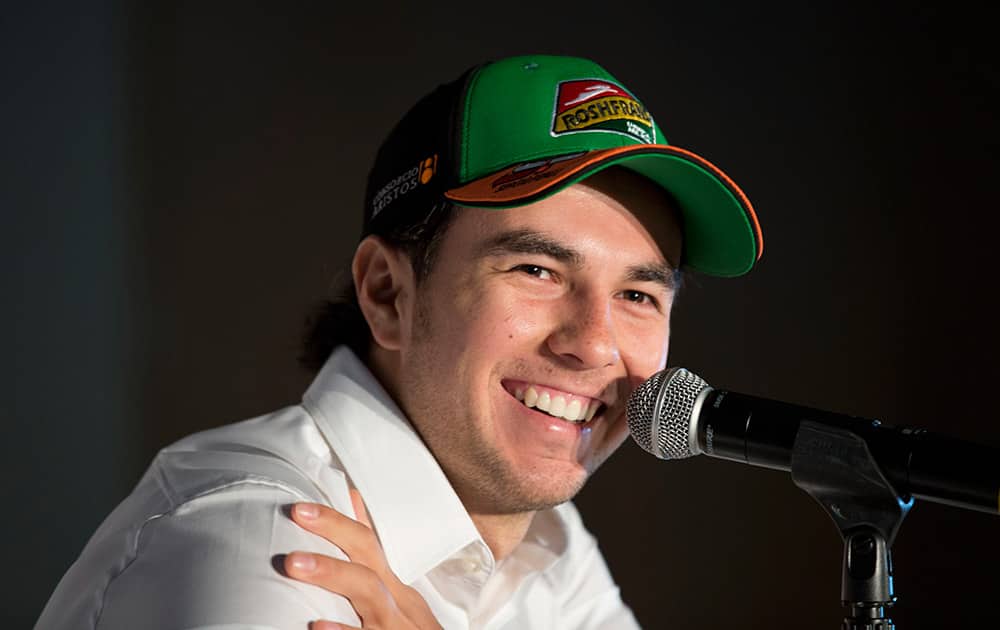 Force India driver Sergio Perez of Mexico smiles during a press conference in Mexico City. Formula One racing will return to Mexico in 2015 after an absence of 23 years.
