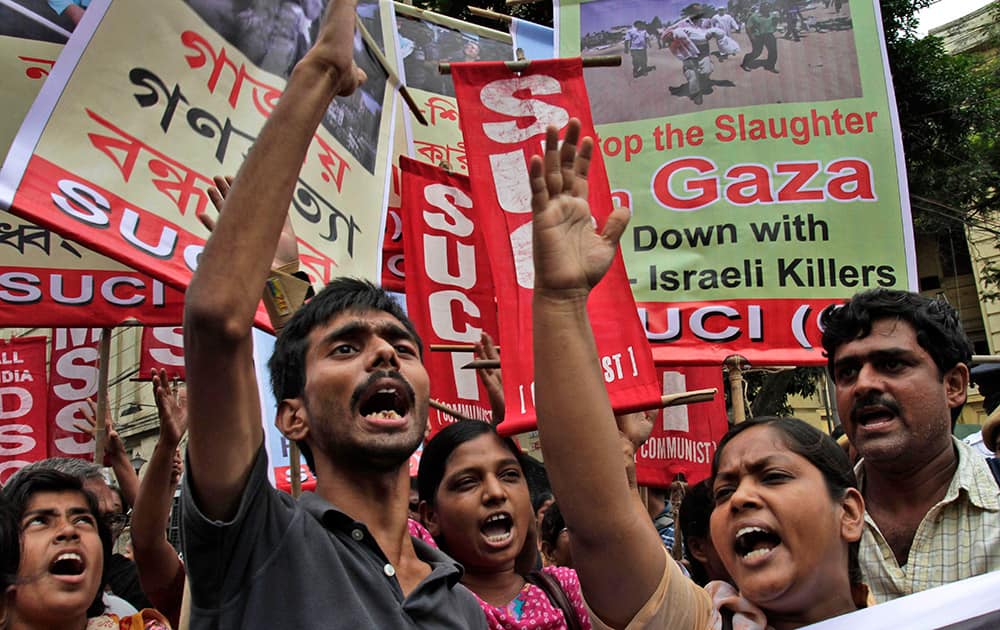 Activists of Socialist Unity Center of India, SUCI, shout slogans during a protest against Israel’s attack on Gaza in Kolkata.