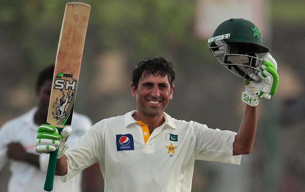 Pakistan`s batsman Younis Khan celebrates scoring a century during the first day`s play of the first test cricket match between Sri Lanka and Pakistan in Galle, Sri Lanka.