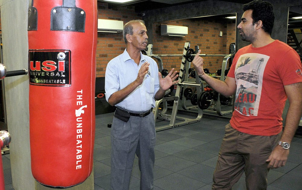 BCCI`s West Zone in-charge of Ground and pitch committee, Sudhir Naik (L) with cricketer Zaheer Khan at the latter`s fitness center, Prosport, in Mumbai.