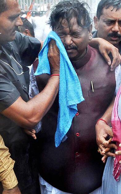 Former Jharkhand Chief Minister Arjun Munda gets injured after police used water cannon and tear gas during Vidhan Shabha Gherao by BJP workers in Ranchi, Jharkhand.