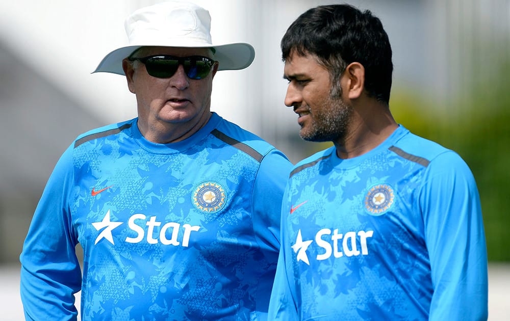 Duncan Fletcher speaks with MS Dhoni during a nets practice session at Old Trafford, Manchester, England.