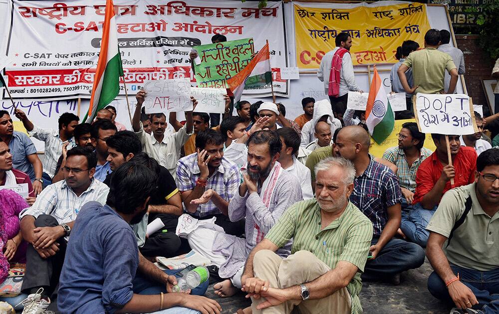 AAP leader Yogendra Yadav with students at protest against C-SAT in civil services examinations in New Delhi.