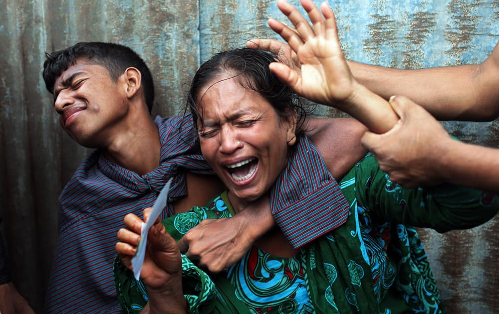Bangladeshi woman Munni, whose daughters are missing, cries as rescuers search the River Padma after a passenger ferry capsized in Munshiganj district, Bangladesh.