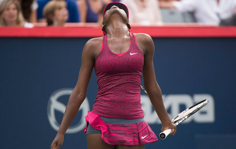 Francoise Abanda from Canada reacts during her opening round match against Dominika Cibulkova from Slovakia at the Rogers Cup tennis tournament in Montreal.
