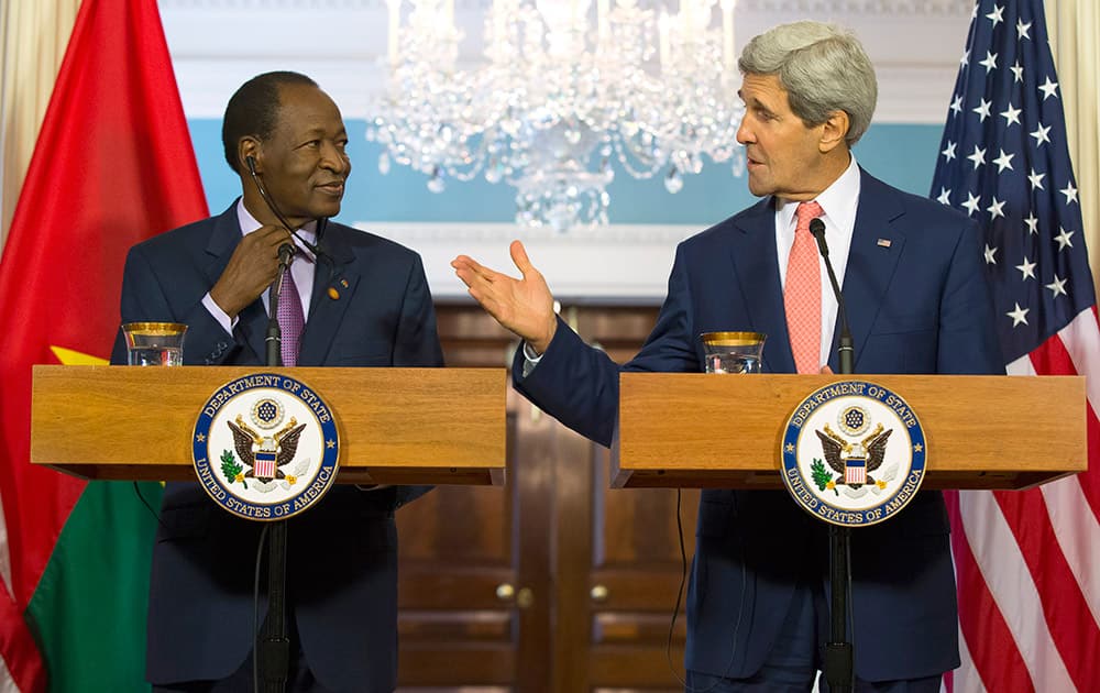 Secretary of State John Kerry and Burkina Faso President Blaise Campaoré participate in a joint news conference before a bilateral meeting during the US Africa Leaders Summit, at the State Department in Washington.