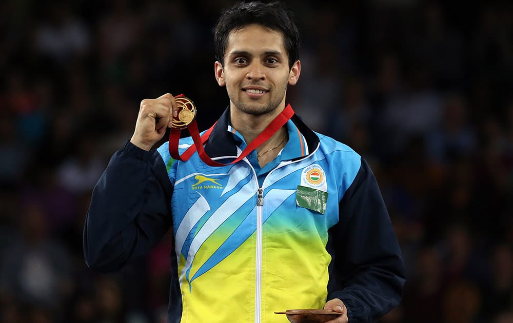 India`s Kashyap Parupalli poses with his gold medal after his victory over Singapore`s Derek Wong at the end of their men`s single`s Badminton match at the Emirates Arena during the Commonwealth Games Glasgow 2014.