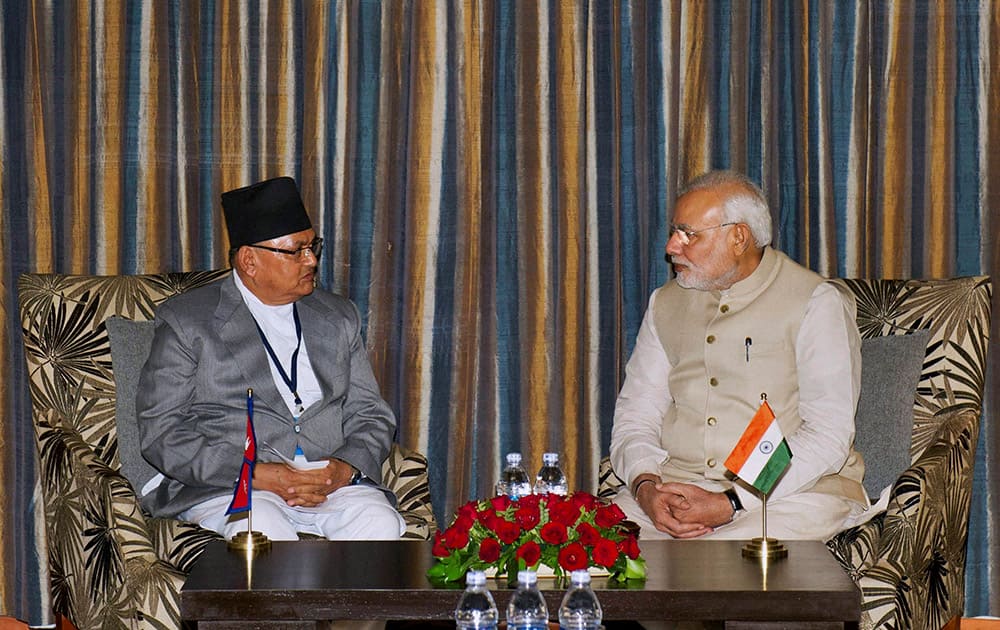 Prime Minister Narendra Modi talking with Nepalese Foreign Minister Mahendra Bahadur Pandey during a meeting in Kathmandu, Nepal.
