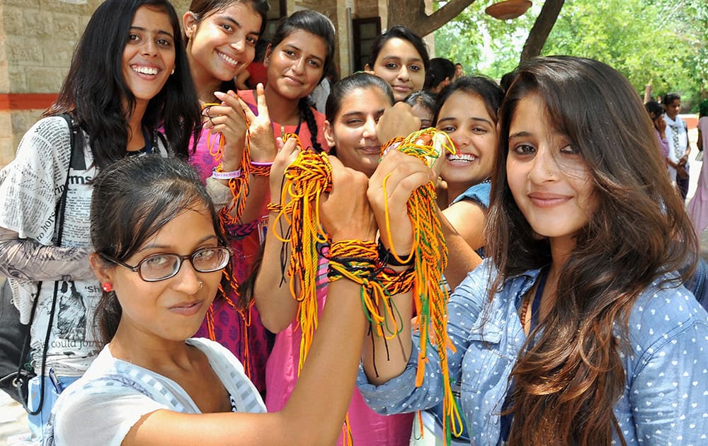 Girls making preparations for friendship day falling on Sunday by exchanging gifts and friendship bands in Jaipur.
