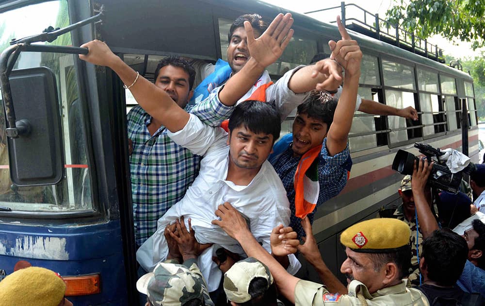 Police detaining NSUI members during a protest against CSAT format in front of residence of Union Home Minister Rajnath Singh in New Delhi.
