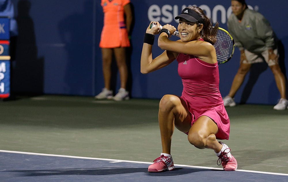 Ana Ivanovic, from Serbia, returns the ball to Serena Williams during the third set of their match in the Bank of the West Classic tennis tournament in Stanford, Calif.
