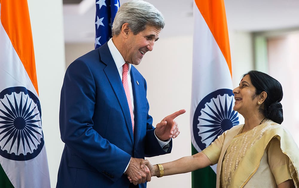 US Secretary of State, John Kerry shakes hands with Indian Foreign Minister Sushma Swaraj in New Delhi.