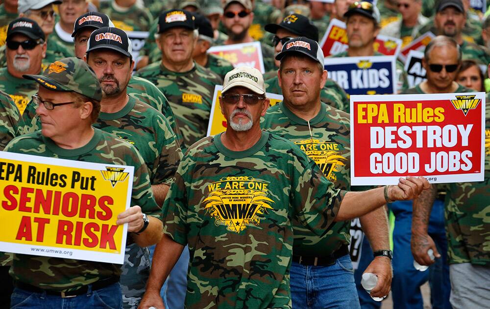 Union members, led by the United Mine Workers of America, march through downtown Pittsburgh to the William S. Moorhead Federal Building.