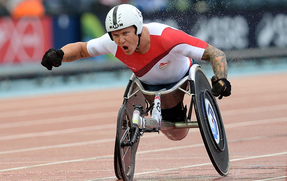 England`s David Weir celebrates winning the Men`s Para-sport 1,500m T54 at Hampden Park, Glasgow, Scotland, during the 2014 Commonwealth Games.