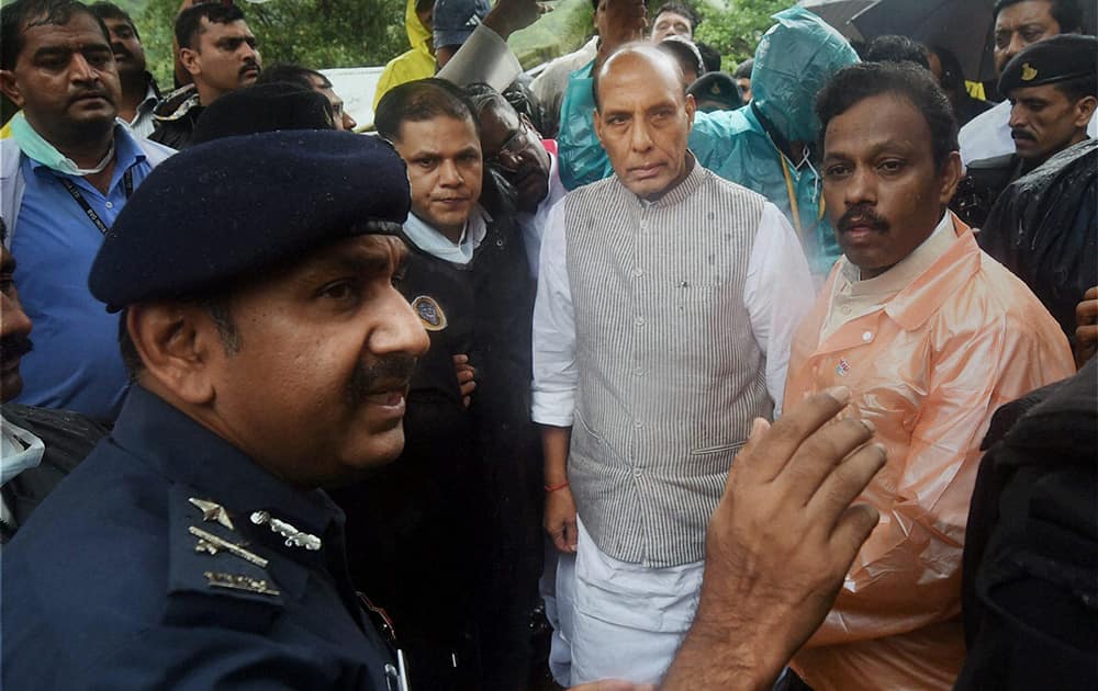 Union Home Minister Rajnath Singh meets disaster management officials during a visit to the site of landslide at Malin village in Pune, Maharashtra.