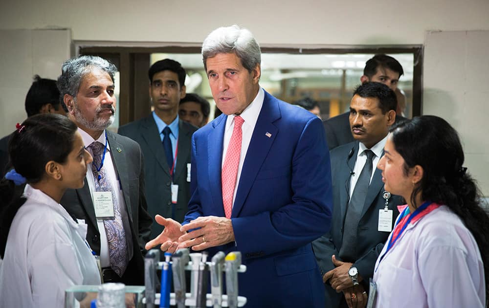 US Secretary of State, John Kerry, speaks with graduate students about their work at the Indian Institute of Technology in New Delhi.