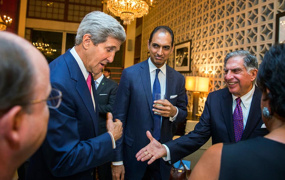 US Secretary of State John Kerry greets Indian businessman Ratan N. Tata with US Secretary of Commerce, Penny Pritzker before a dinner at the US Ambassador`s residence in New Delhi.