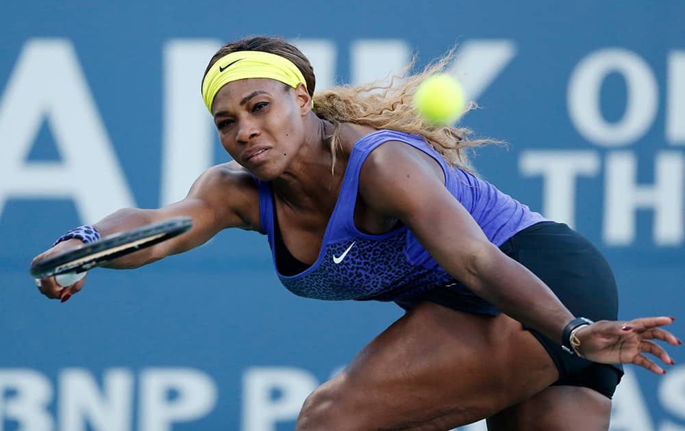 Serena Williams returns the ball during the second set of her match against Karolina Pliskova in the Bank of the West Classic Tennis Tournament.