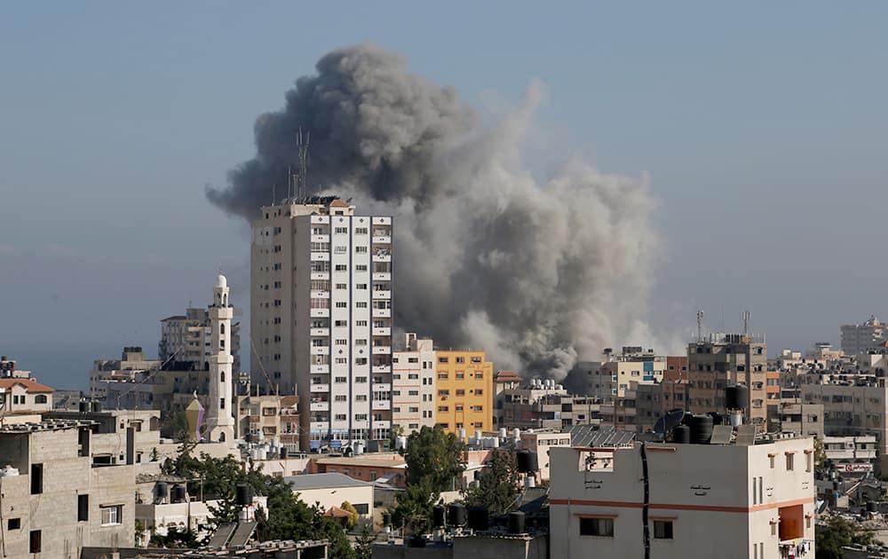 Smoke and fire from the explosion of an Israeli strike rise over Gaza City, amid Israel`s heaviest air and artillery assault in more than three weeks of Israel-Hamas fighting.