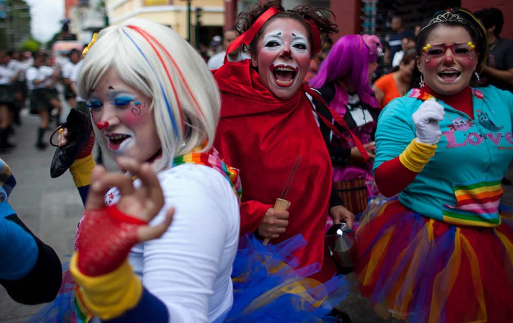 Clowns dance in the Parade of Clowns as part of the sixth annual Latin American Clown Congress in Guatemala.