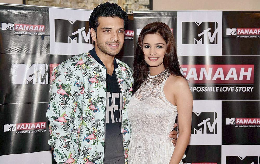 Bollywood actors Karan Kundra and Chetna Pande pose for photographers at a promotional event for their upcoming MTV show Fannah, in New Delhi.