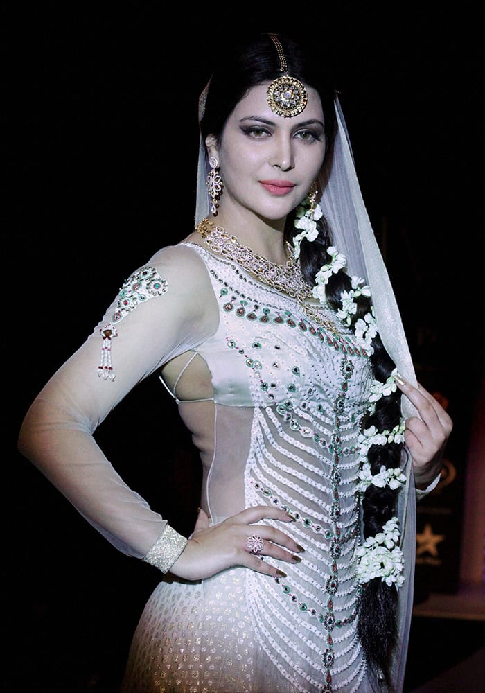 Former Miss India Ankita Shorey poses in a jewellery design by Queenie Singh during the India International Jewellery Week (IIJW) in Mumbai.